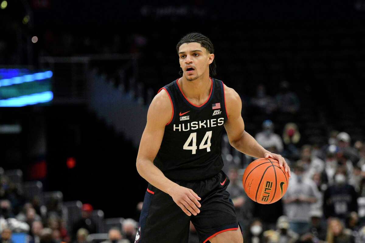 Connecticut guard Andre Jackson (44) in action during the first half of an NCAA college basketball game against Georgetown, Sunday, Feb. 27, 2022, in Washington. Connecticut won 86-77. (AP Photo/Nick Wass)