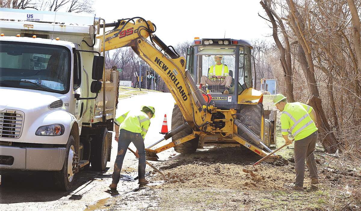 John Badman|The Telegraph Workers from Illinois American Water Company early Tuesday afternoon were finishing up repairs on a water main break on Stanley Road near Lee Avenue. Stanley Road was closed between Lee Avenue and First Street until the repairs were completed.