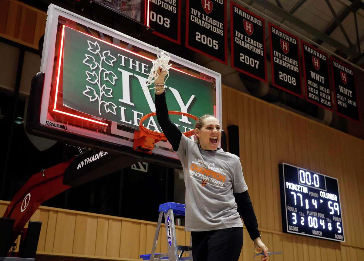 Princeton coach Carla Berube celebrates while cutting down the net after Princeton defeated Columbia in the Ivy League championship game Saturday. Berube, a former UConn player, will lead her Tigers as a 10 seed in the Bridgeport Regional.