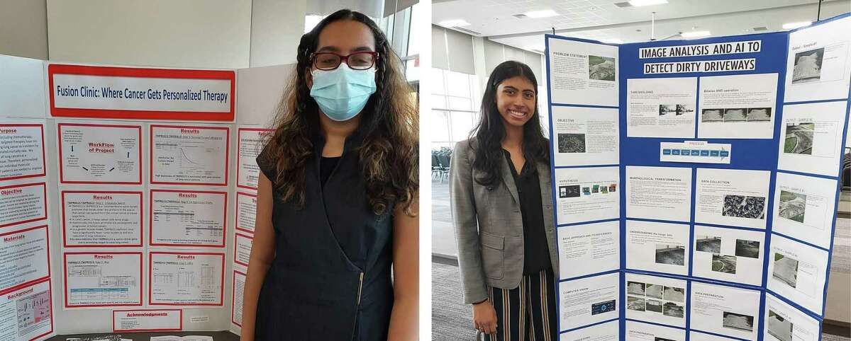 Shadow Creek High School students Prisha Verma, left, and Tanya Mahesh stand with their displays at the Science and Engineering Fair of Houston in February.