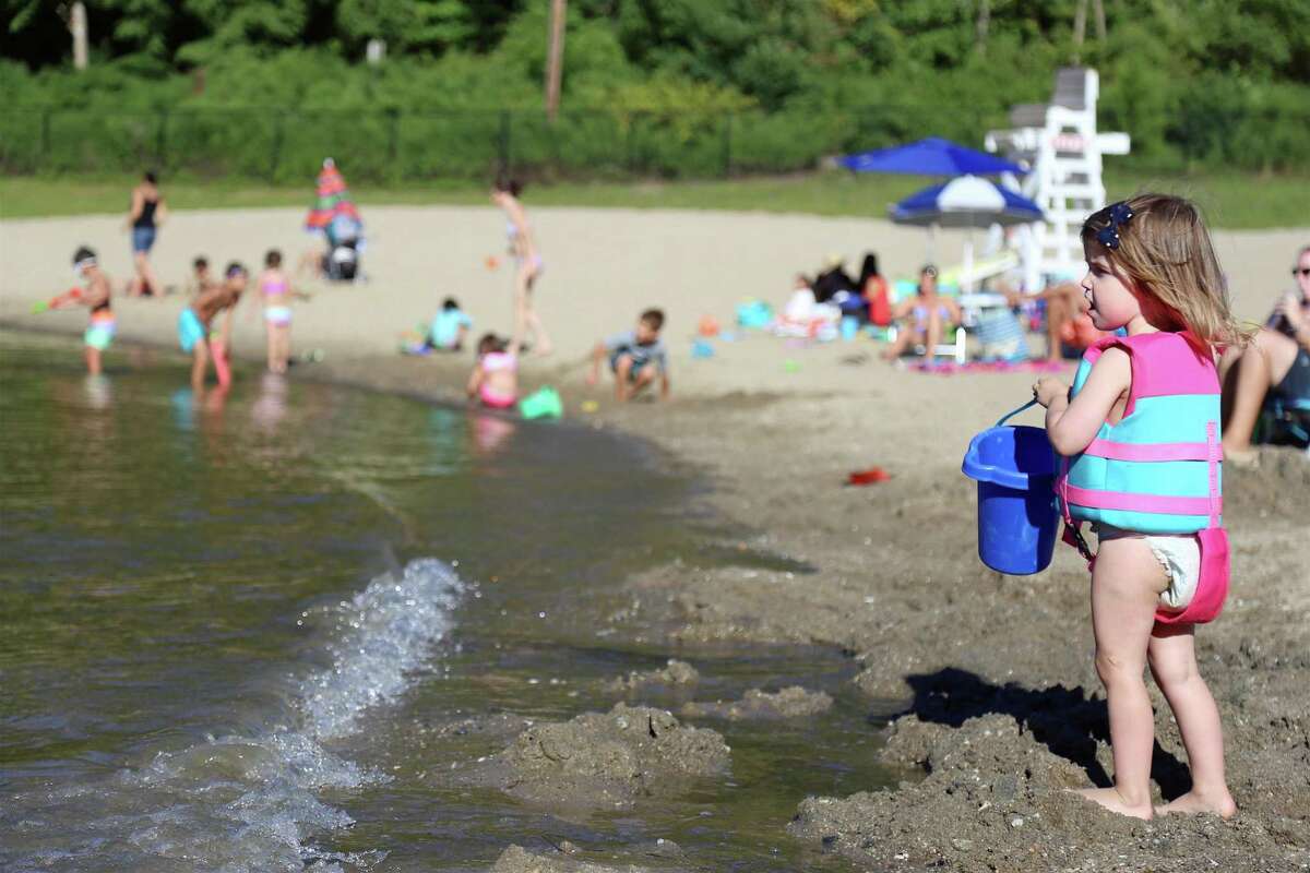 Reagan Ippolito, 2, of Fairfield checks out the water at Lake Mohegan on Sunday, Aug. 30, 2020, in Fairfield, Conn.