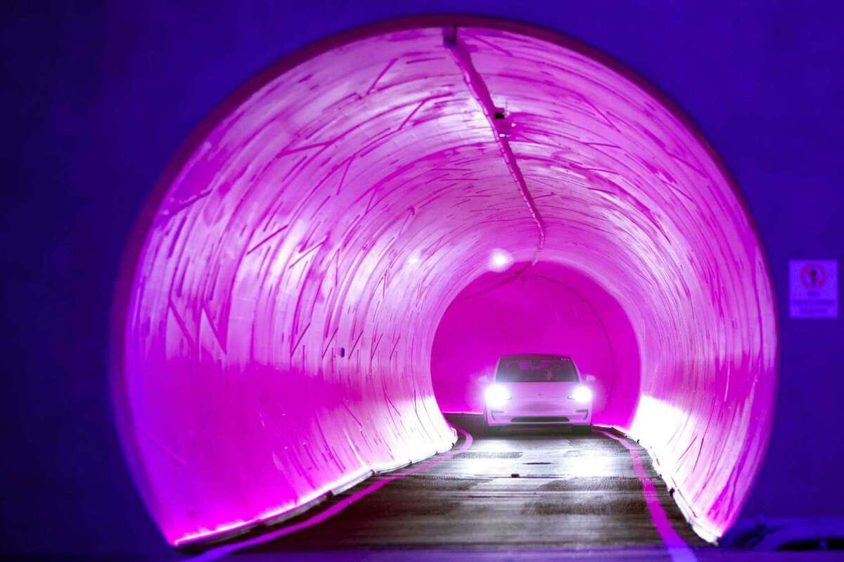 A Tesla electric car heads through a tunnel during a tour of the Las Vegas Convention Center Loop, Elon Musk’s underground transportation system, under the Las Vegas Convention Center in April. The Las Vegas Convention Center Loop is the first commercial endeavor for Musk’s Boring Co.