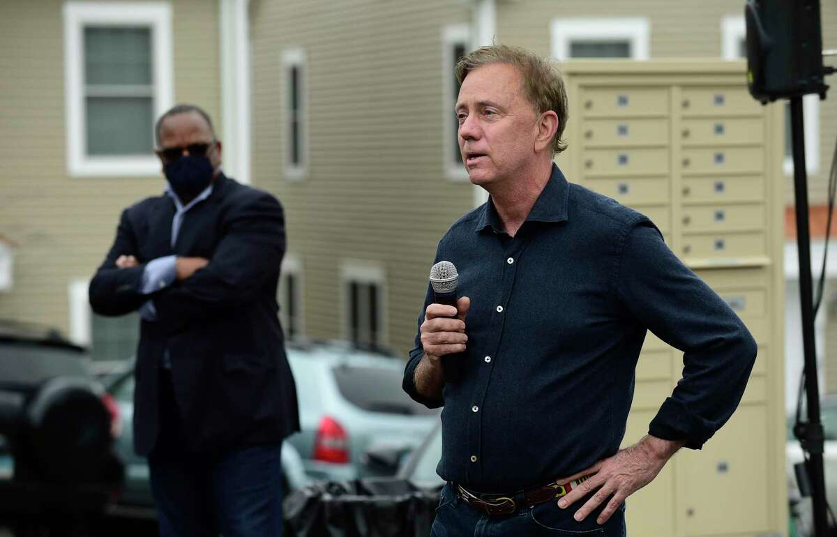 Gov. Ned Lamont speaks at a Greenwich Communities plaque dedication at its Armstrong Court affordable housing apartment complex on Saturday, April 10, 2021, in Greenwich, Conn. Lamont said he supports Greenwich’s efforts to build more affordable housing, which was brought up Monday night as the RTM adopted a resolution against the 8-30g act in Hartford.