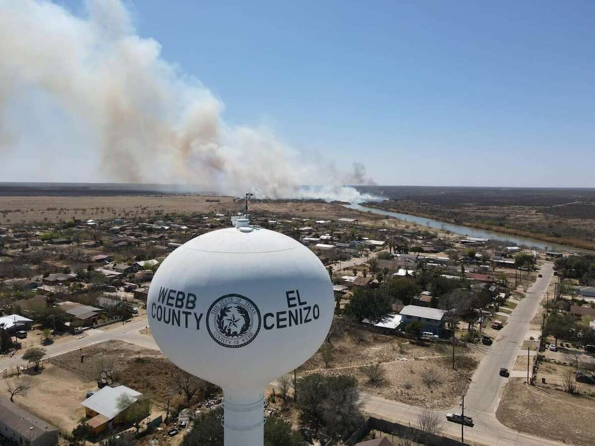 Pictures show brief moment that fire crossed from the Mexican side to the American side into an area near El Cenzo, Texas across the Rio Grande River on March 15, 2022. Photos were taken via a drone from a concerned resident of El Cenizo, Texas. 