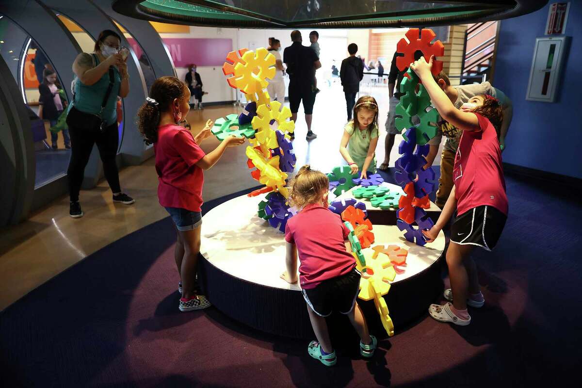 Children play at one of the many interactive exhibits as families spend time at the DoSeum as spring break went into full effect Monday. The museum was expected to reach full capacity each day this week as students enjoy a week away from school. Some families are visiting from outside San Antonio.