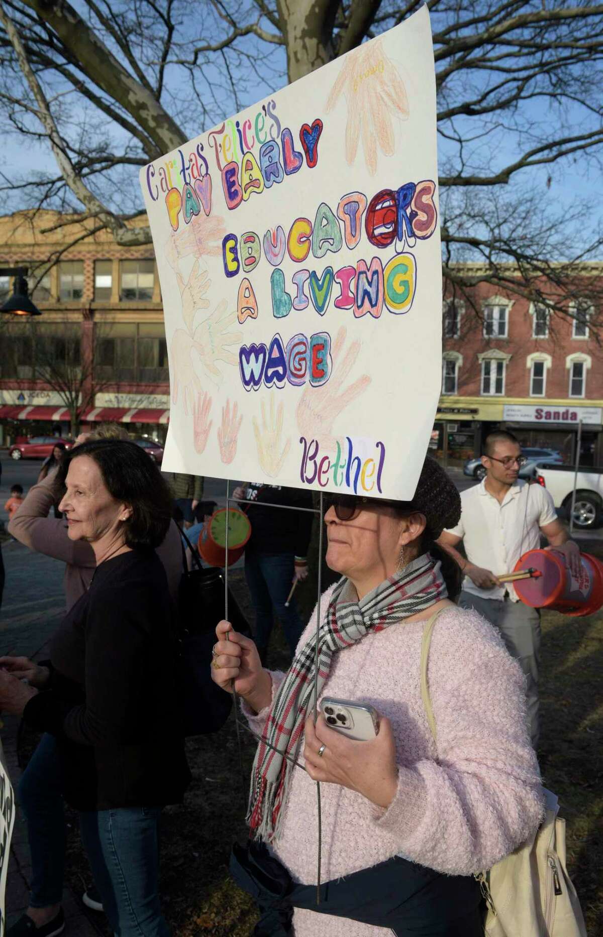 Brigida Mendieta, a child care provider, attended a rally in front of the Public Library by child care workers on March 15, 2022. The groups gathered were calling for better reimbursement for state-funded child care costs, as well as a raise in minimum wage pay.
