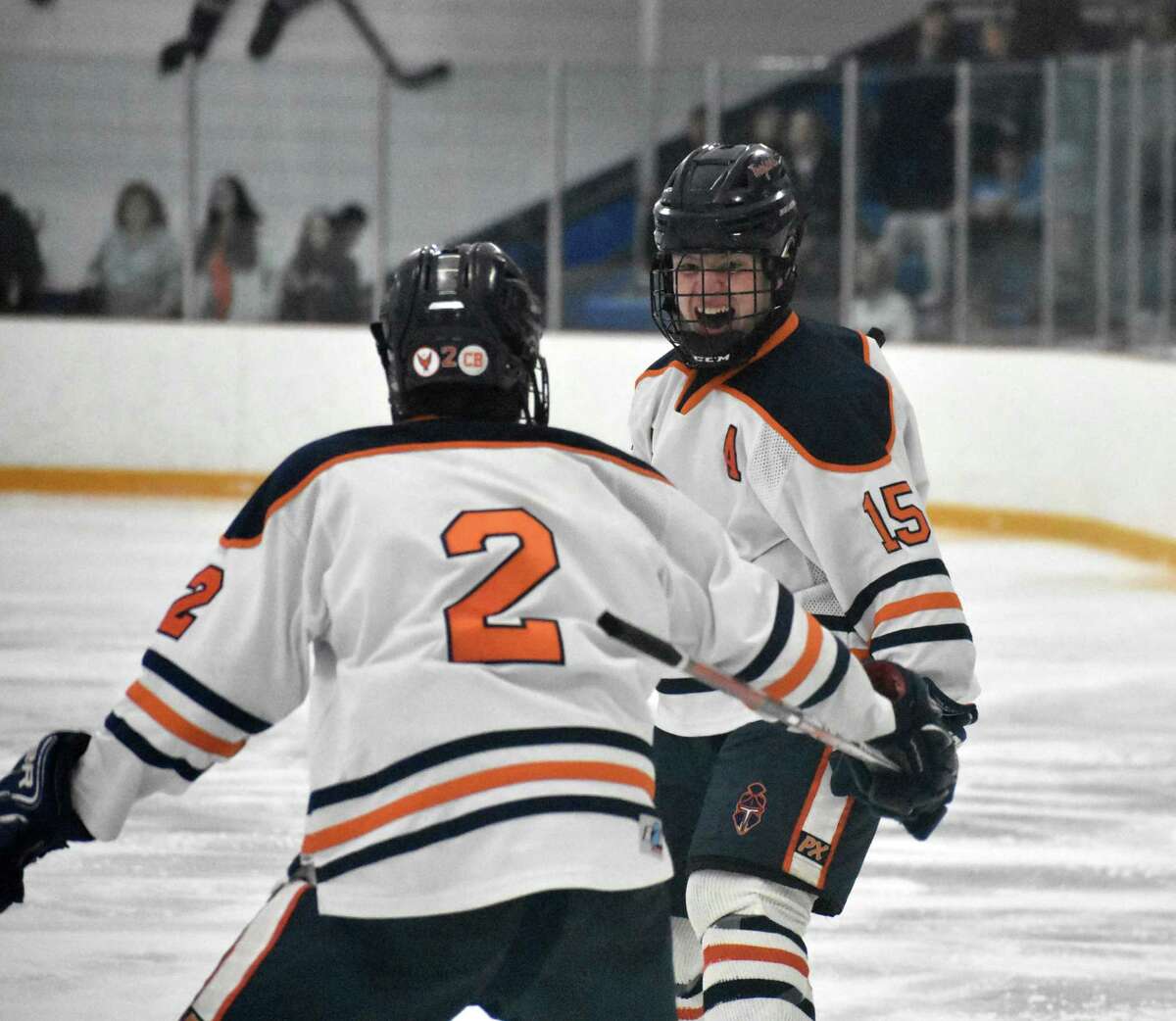 Lyman Hall’s Dan Pettit celebrates his goal with brother Zach Pettit during the CIAC Division II semifinals against Wethersfield on Tuesday at Bennett Rink in West Haven.