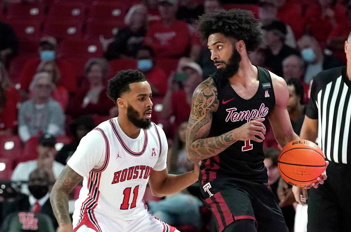 UH guard Kyler Edwards (11) showed his defensive prowess against Temple’s Damian Dunn, helping hold the second-team All-AAC selection to five points in their March 3 meeting at Fertitta Center.
