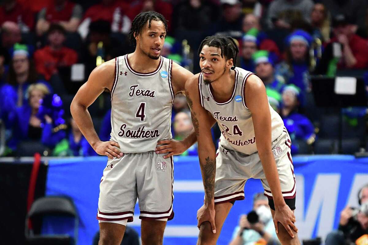 DAYTON, OHIO - MARCH 15: Bryson Etienne #4 and John Walker III #24 of the Texas Southern Tigers talk during the second half against the Texas A&M-CC Islanders in the First Four game of the 2022 NCAA Men's Basketball Tournament at UD Arena on March 15, 2022 in Dayton, Ohio.