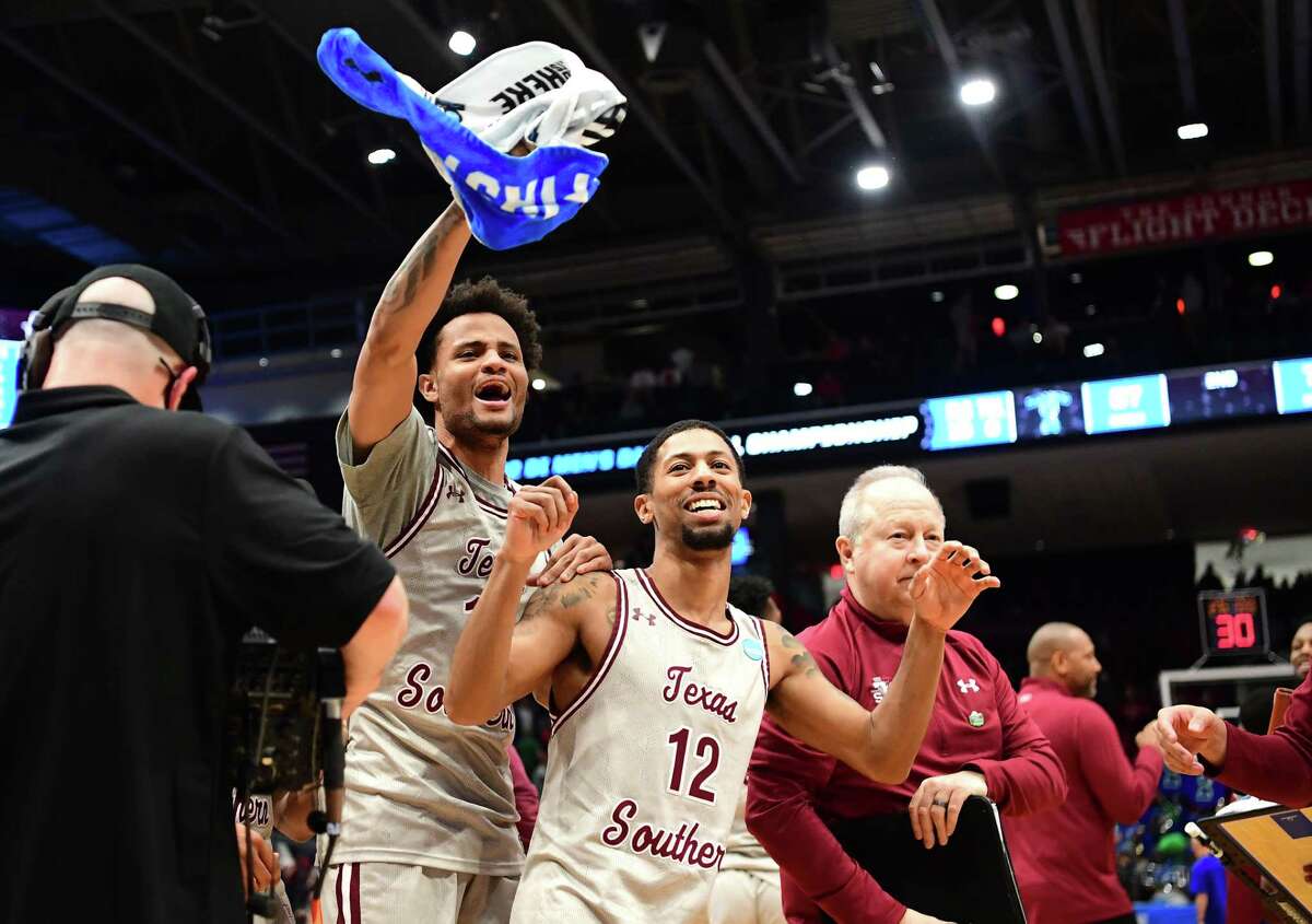 DAYTON, OHIO - MARCH 15: Jordan Gilliam #11 and John Jones #12 of the Texas Southern Tigers celebrate after defeating the Texas A&M-CC Islanders 76-67 in the First Four game of the 2022 NCAA Men's Basketball Tournament at UD Arena on March 15, 2022 in Dayton, Ohio.