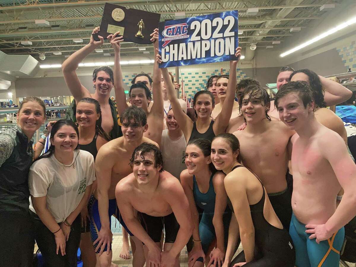 Holy Cross celebrates atfer winning the CIAC Class S boys swimming and diving championship on Tuesday, March 15, 2022 at Cornerstone Pool in West Hartford, Conn.