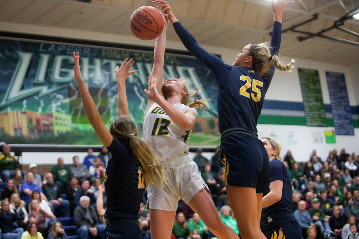 Dow's Alexa Kolnitys takes a shot during the Chargers' state quarterfinal loss to Hartland Tuesday, March 15, 2022 at Lapeer High School.