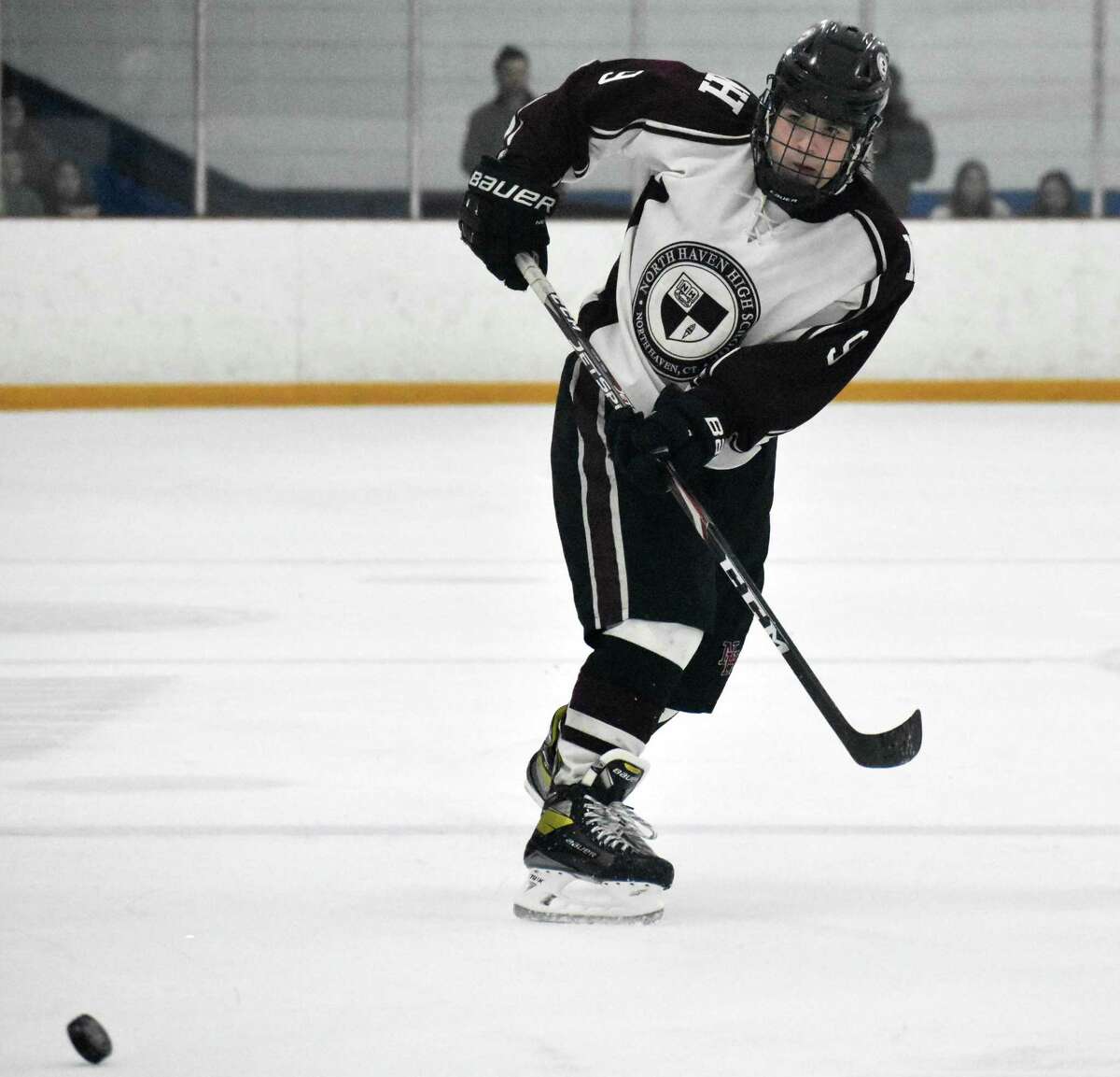 North Haven's Justin Pniewski makes a pass during the CIAC Division II boys hockey semifinals on Tuesday.