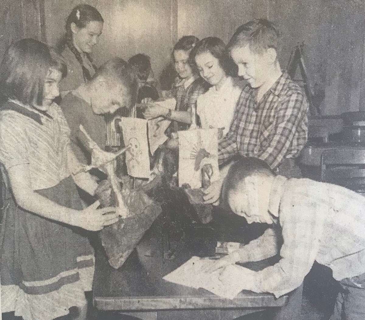 Norwegian Vikings, as part of a unit on Norway, is the topic studied by pupils in Virgina Farnham's fourth grade class at Eastlawn School. From left, Judy Gunterman, Richard Laczko, Helen Mary Spencer, David Wieland, Norma Richardson, Judith German, Walter Woodruff and Lyle Howe. January 1949
