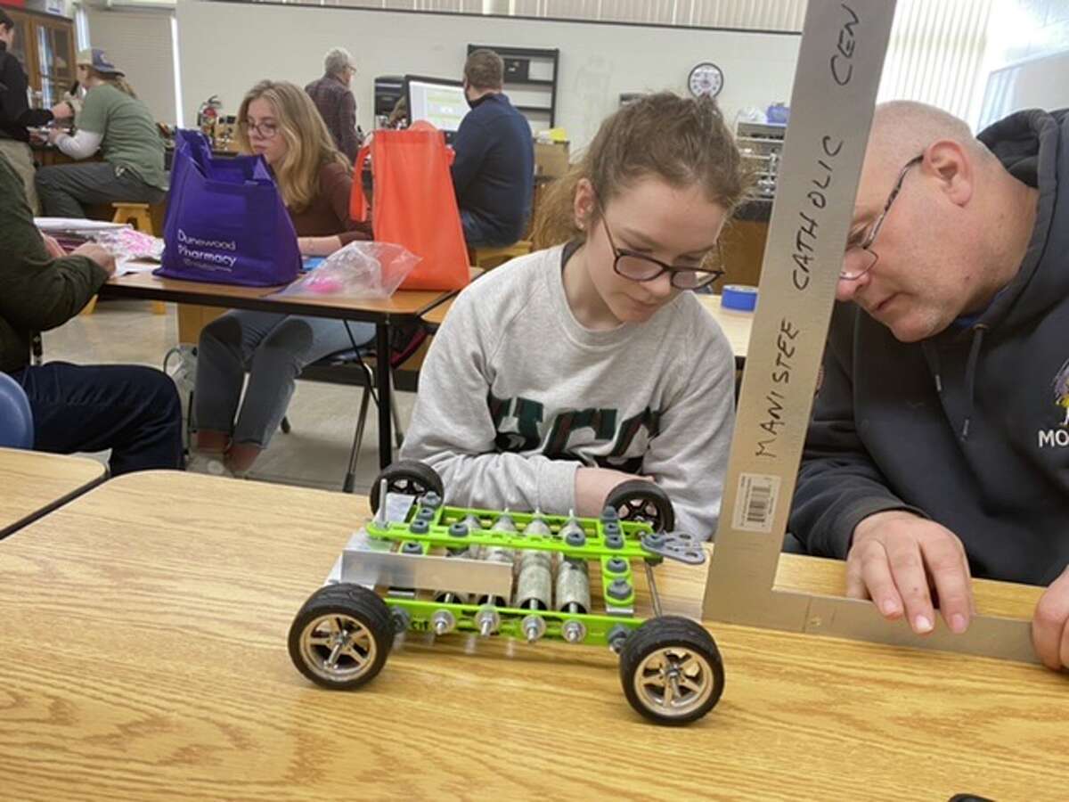 Manistee Catholic Central student Brenna Johnson works on her gravity vehicle at the school during a Science Olympiad practice. MCC competes in a regional competition on Friday and Saturday, with Saturday's events taking place at Mid Michigan College in Mount Pleasant.