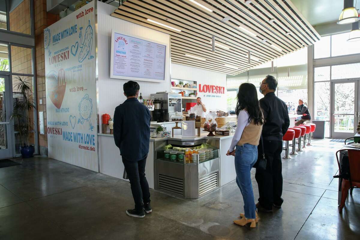 Folks read the menu at Loveski Deli, a Jewish-inspired deli at the Oxbow Public Market in Napa, Calif. Loveski makes the Oxbow Market one of Chronicle reporter Jess Lander’s favorite regular spots this year.