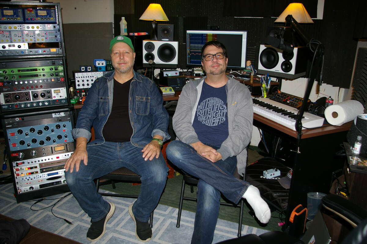 Donny Brown, left and Andy Reed, right, pose at Reed Recording Studio in Bay City. The two have known each other for quite some time as fellow musicians and as friends.
