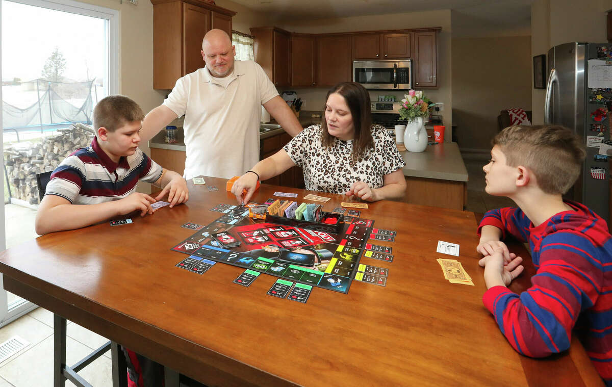 Nolan Balcitis plays the board game Monopoly with his family. Reports of rising diabetes cases during the pandemic have scientists exploring if there could be a link with the coronavirus. Emerging evidence shows the virus can attack insulin-producing cells in the pancreas, a process that might trigger diabetes in susceptible people.