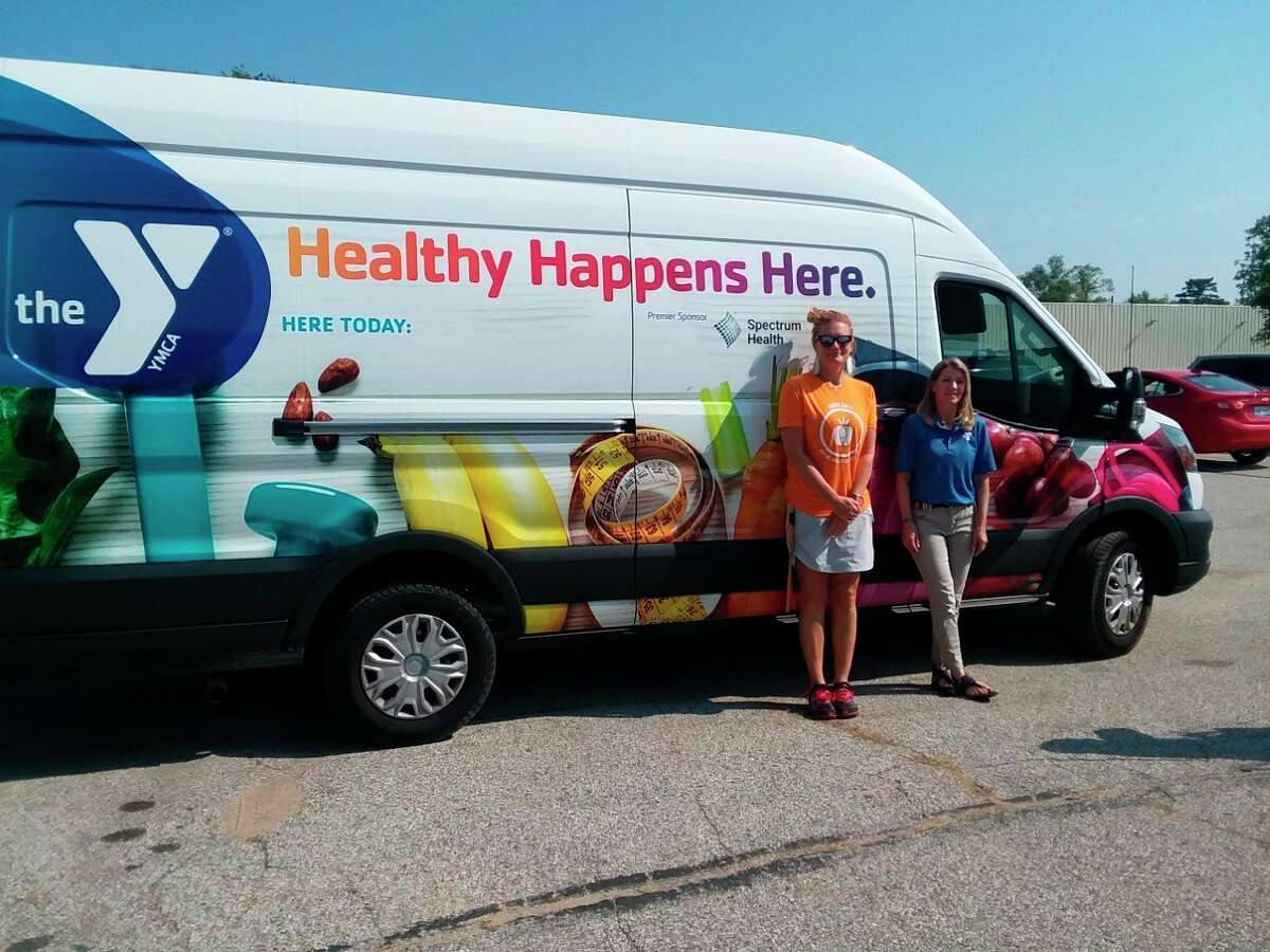 The YMCA in Grand Rapids, in partnership with Spectrum Health, will bring its "Veggie Van" to the Mecosta County Fairgrounds at 10 a.m. Saturday, March 26. Above is a submitted photo of when the van visited the Bread of Life Pantry in Baldwin last year.