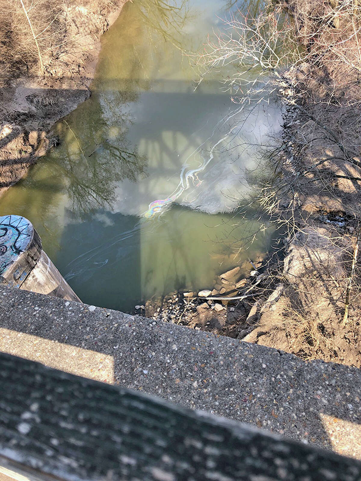 This photo, taken Tuesday by Edwardsville resident and Sierra Club member Toni Oplt, was taken from a bridge crossing the Cahokia Diversion Channel and shows crude oil in the water from last Friday’s oil spill, which occurred near the intersection of Illinois 143 and Illinois 159.