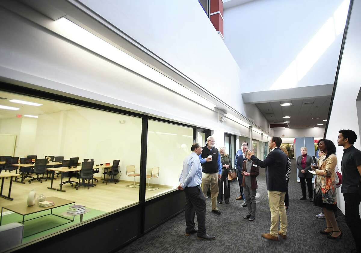 J.J. Oshins, chief investment officer of NRDC Equity Partners, gives a tour of the new Jeff Works coworking spaces, now filling many of the vacant interior store spaces at the Hawley Lane Mall in Trumbull, Conn., on Wednesday, March 16, 2022.