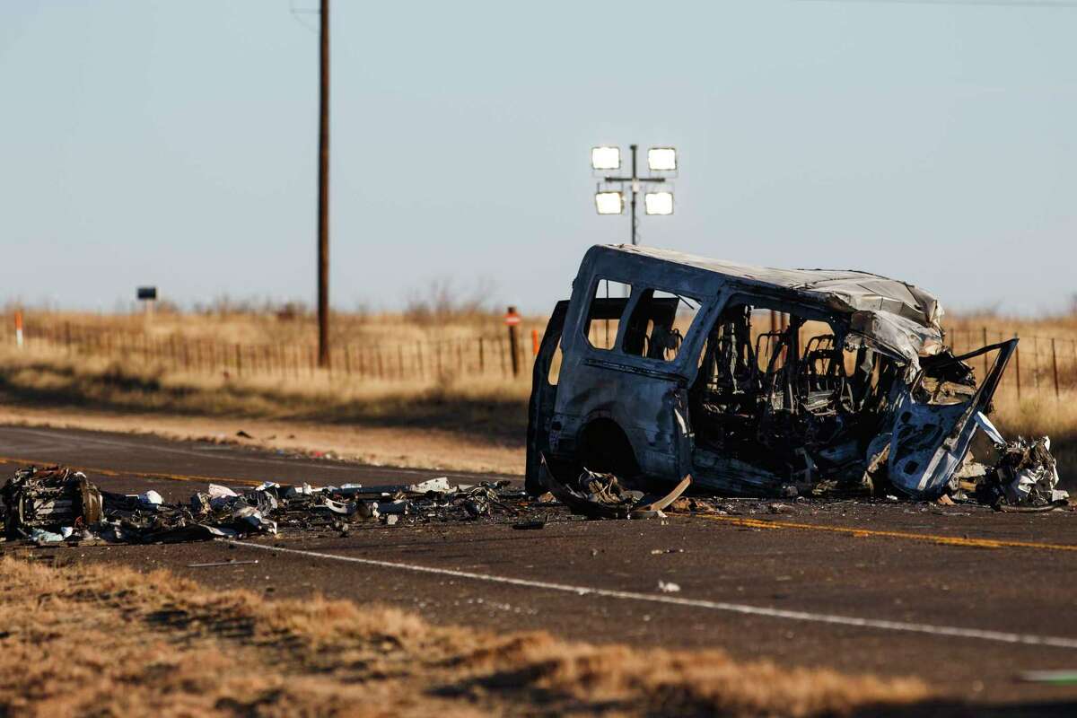 A damaged bus sits on the side of the road at the scene of a fatal car wreck in March 2022, on Farm-to-Market Road 1788 in Andrews County, Texas.  
