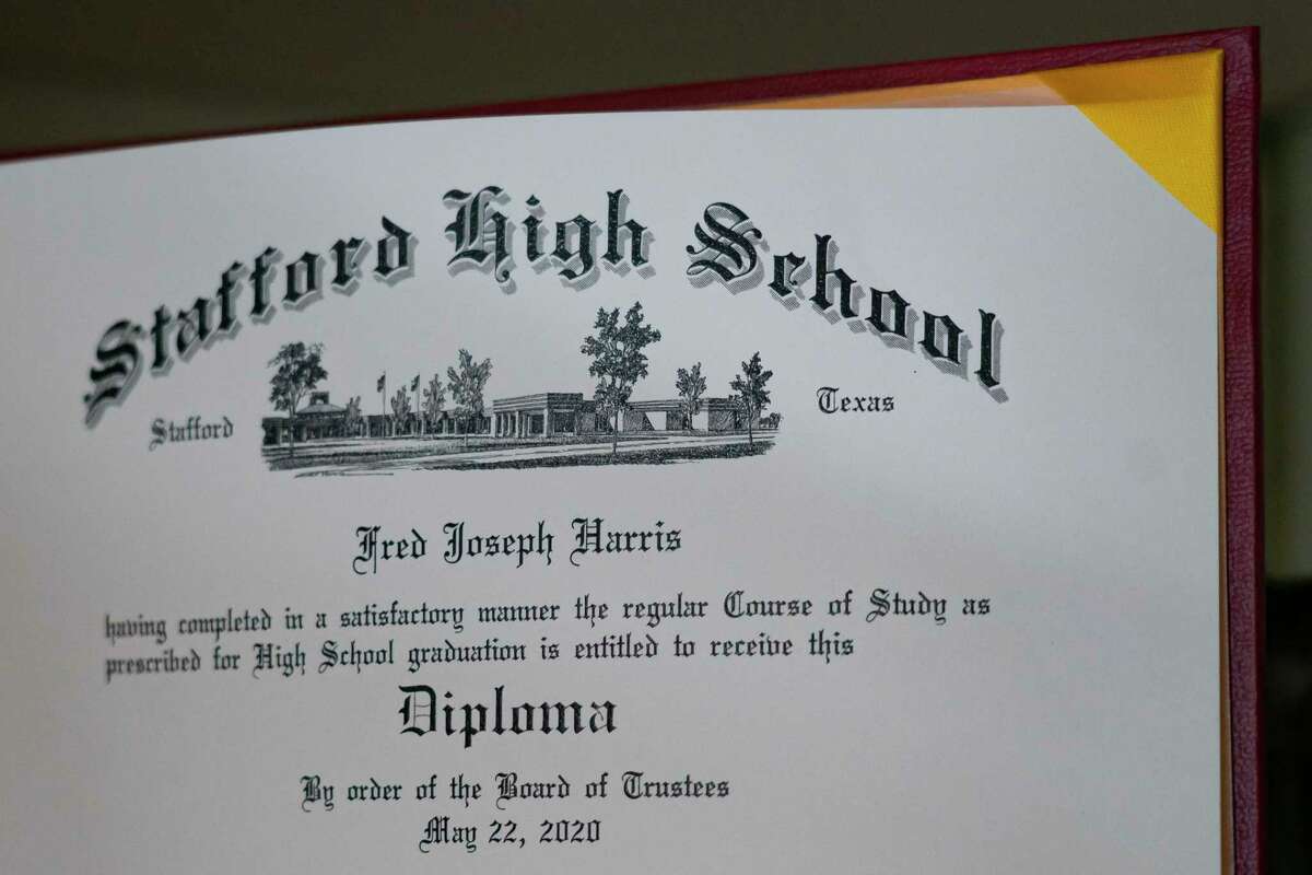 Dallas Garcia, whose son Fred Harris, who was nineteen-years-old and had special needs when he was killed in the Harris County Jail by another inmate in 2021, keeps his high school diploma that he had earned a year before he was killed on a shelf in her Stafford home, Friday, Dec. 17, 2021.