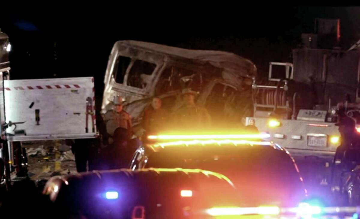 Emergency responders work the scene of a fatal crash late Tuesday, March 15, 2022 in Andrews County, Texas. A vehicle carrying members of the University of the Southwest's golf teams collided head-on with a pickup truck in West Texas, killing multiple people, authorities said. (NewsWest 9 KWES-TV via AP)
