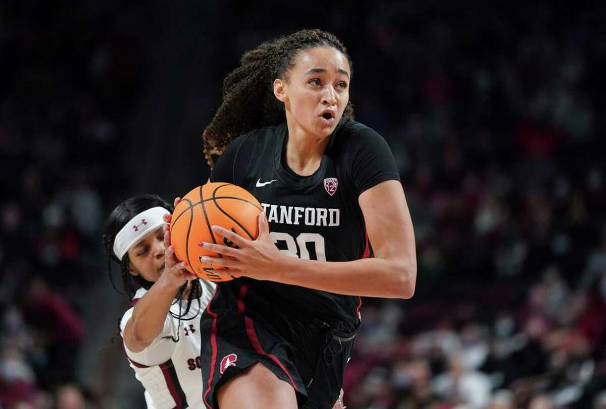 Stanford guard Haley Jones (30) drives to the hoop against South Carolina guard Destanni Henderson during the second half of an NCAA college basketball game Tuesday, Dec. 21, 2021, in Columbia, S.C. South Carolina won 65-61. (AP Photo/Sean Rayford)