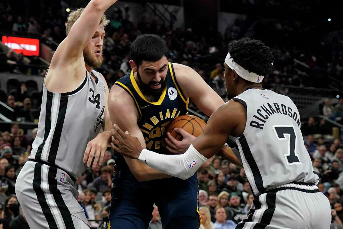 The Spurs’ Josh Richardson (7) hounds the Pacers’ Goga Bitadze or what Richardson calls “playing with force.”