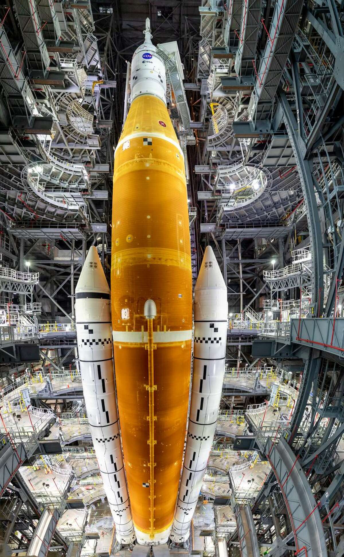 In this panoramic view in High Bay 3 of the Vehicle Assembly Building at NASA’s Kennedy Space Center in Florida, all of the work platforms that surround the Artemis I Space Launch System (SLS) and Orion spacecraft are fully retracted on March 16, 2022.