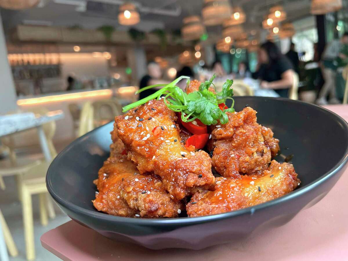 Thai fried wings incorporate Thai chile sauce, herbs and sesame seeds at Box St. All Day, a new Hemisfair restaurant focusing on brunch.