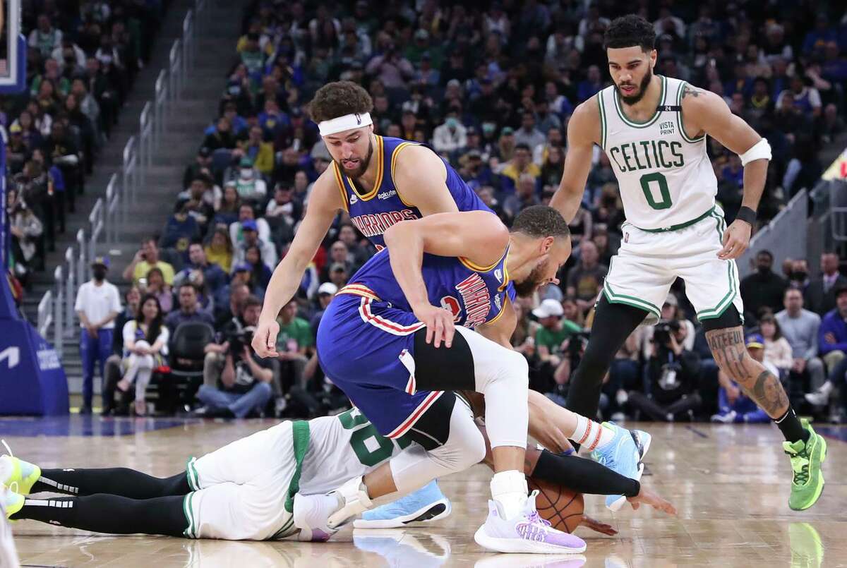 The Warriors’ Stephen Curry injured his foot when Marcus Smart of the Celtics landed on him in a loose-ball scramble.
