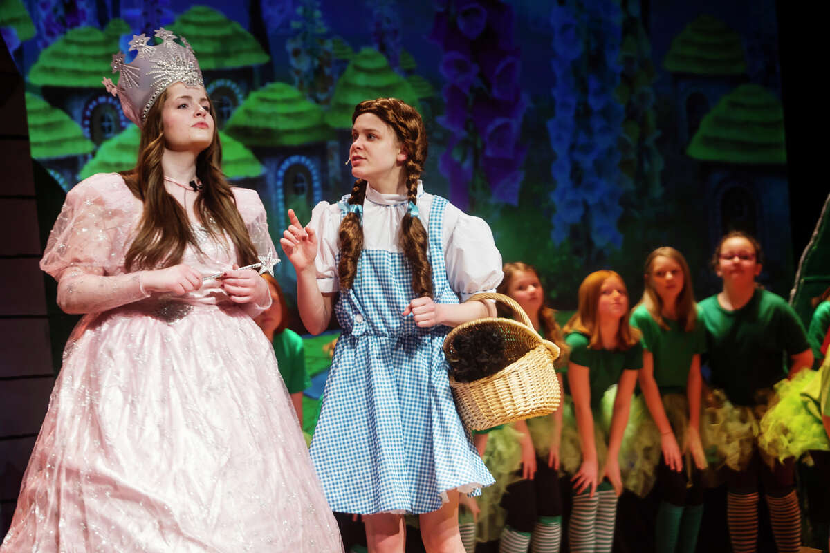 Alex Foor as Dorothy, right, and Paige Lynch as Glinda, left, rehearse a scene during a dress rehearsal for Coleman High School's production of "The Wizard of Oz" Wednesday, March 16, 2022 at Coleman High School.