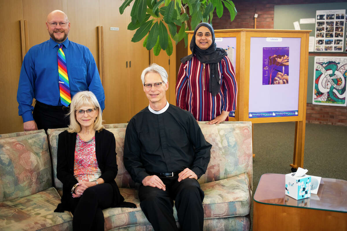 From left, the Rev. Eric Severson of Unitarian Universalist Fellowship of Midland, Pam Fagan, the Rev. Jim Harrison of St. John's Episcopal Church and Umbareen Jamil of the Islamic Center of Midland, all members of Midland Area Interfaith Friends, pose for a portrait Wednesday, March 16, 2022 at St. John's Episcopal Church in Midland.