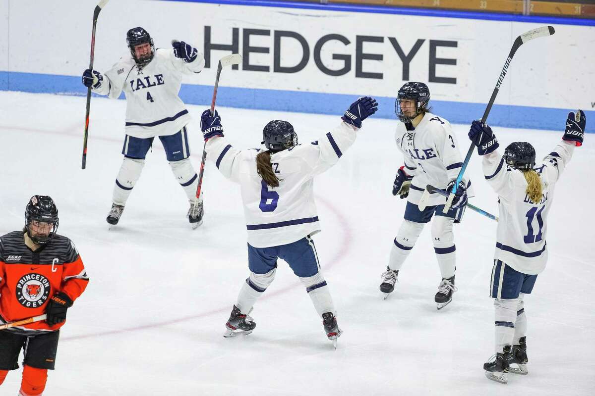 Members of the Yale women’s hockey team celebrate beating Princeton in ECAC semifinals.