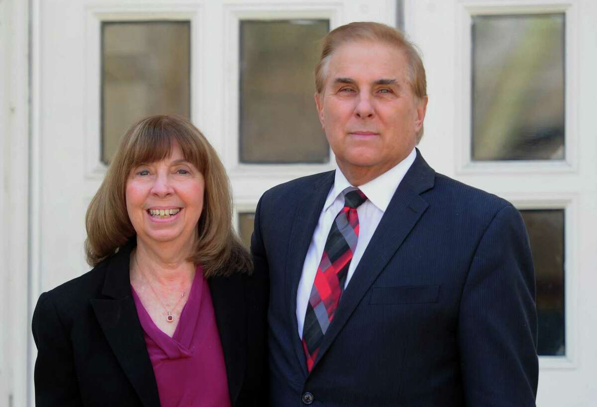 North Mianus Principal Angela Schmidt and Cos Cob Principal Gene Schmidt, who are married, pose together at North Mianus School in Greenwich, Conn., on Friday March 11, 2022. They will both will retire at the end of this school year.