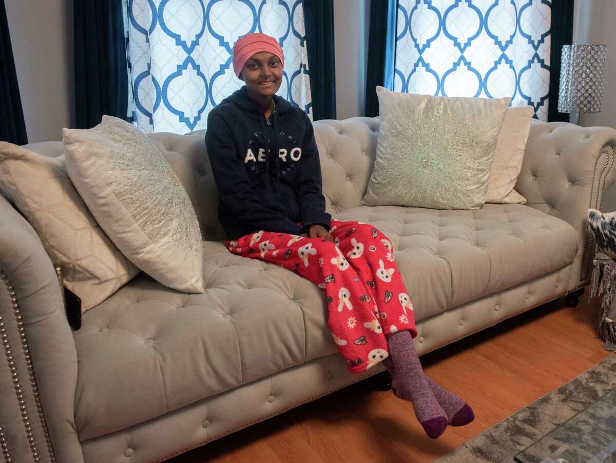 16-year-old Ariana Mohammad, who was was diagnosed with leukemia last year, is seen in her home on Thursday, March 17, 2022 in Schenectady, N.Y.