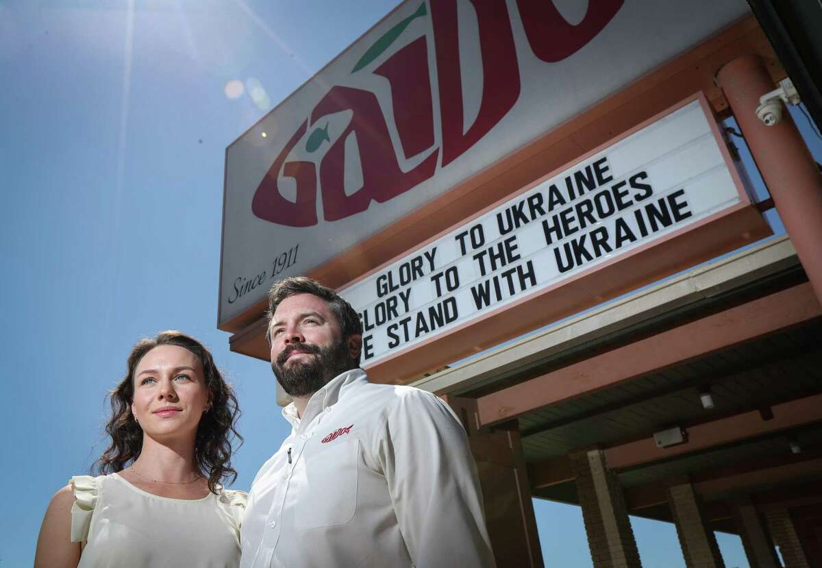 Kateryna Gaido and her husband, Nick Gaido, Tuesday, March 15, 2022, at Gaido’s in Galveston. Signs around the restaurant prompt visitors to donate to people in Ukraine.