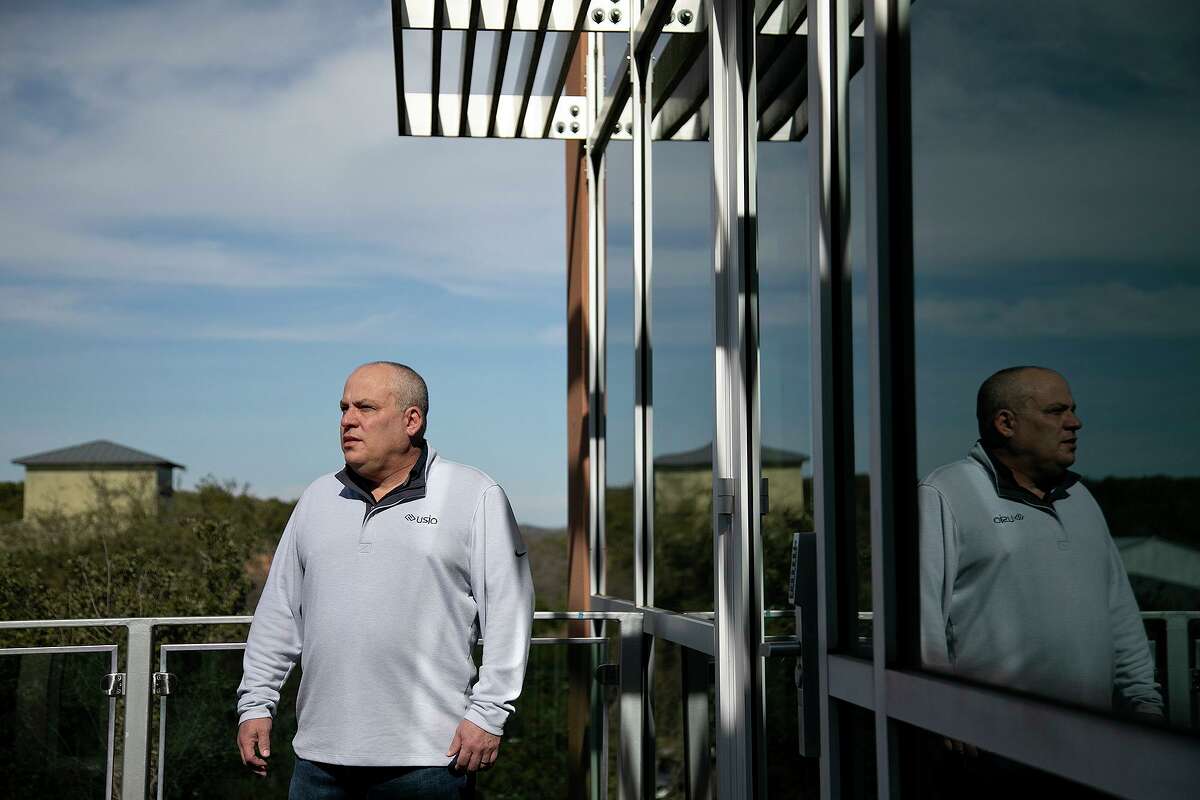 Louis Hoch, CEO and president of Usio Inc., stands on the deck outside his corporate office in San Antonio. The company nearly doubled revenue last year.