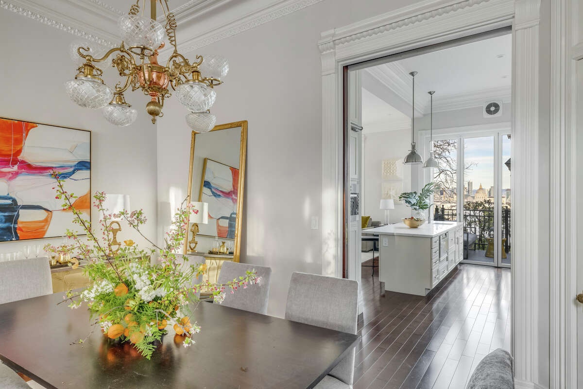 The formal dining room flows into the kitchen.