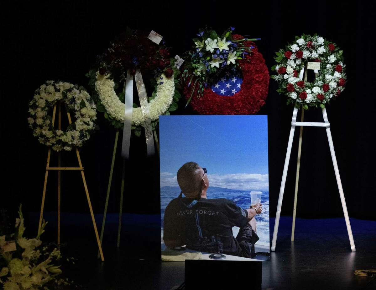 Kevin Nishita, a security guard for a news crew, is memorialized at San Jose Civic Auditorium in December.