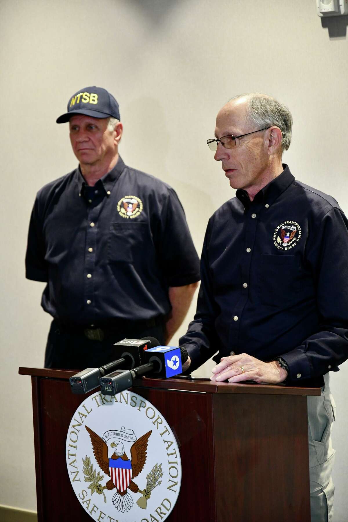 National Transportation Safety Board Vice Chairman Bruce Landsberg, right, and Investigator Robert Acetta answer questions from the media Thursday, March 17, 2022, in Odessa, Texas. NTSB is investigating the March 15, 2022, fatal crash that killed nine people in Andrews, Texas. 