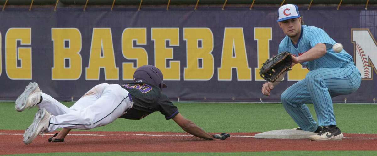 Midland High's Gavin Pinkerton dives back to first to beat the pickoff attempt as San Angelo Central's Stryler Price reaches for the throw 03/17/2022 at Zachery Field. Tim Fischer/Reporter-Telegram