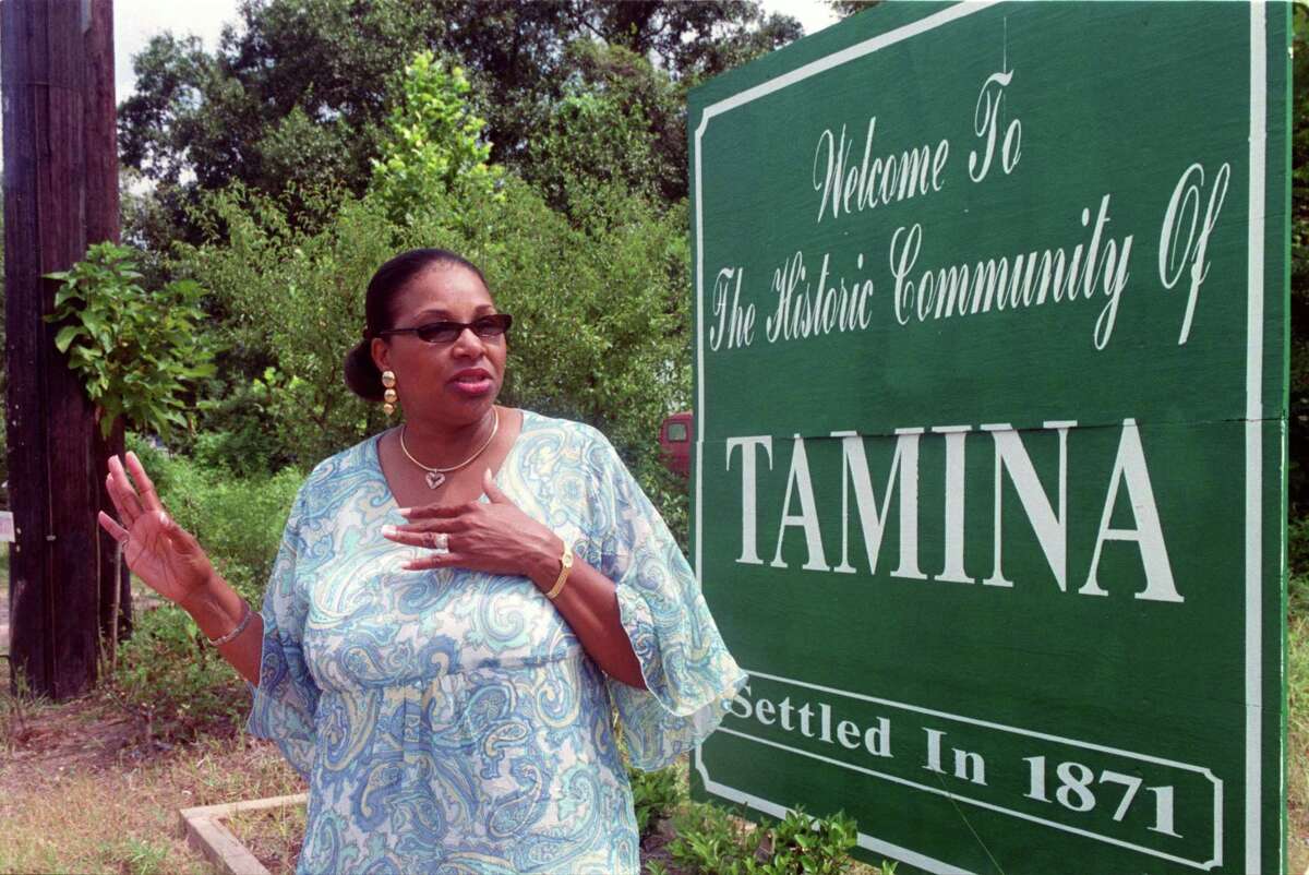 Rita Wiltz is pictured with the welcome sign for Tamina. Wiltz has lived there her whole life as have her ancestors. Her organization Children’s Books on Wheels hosts a Juneteenth celebration June 18.
