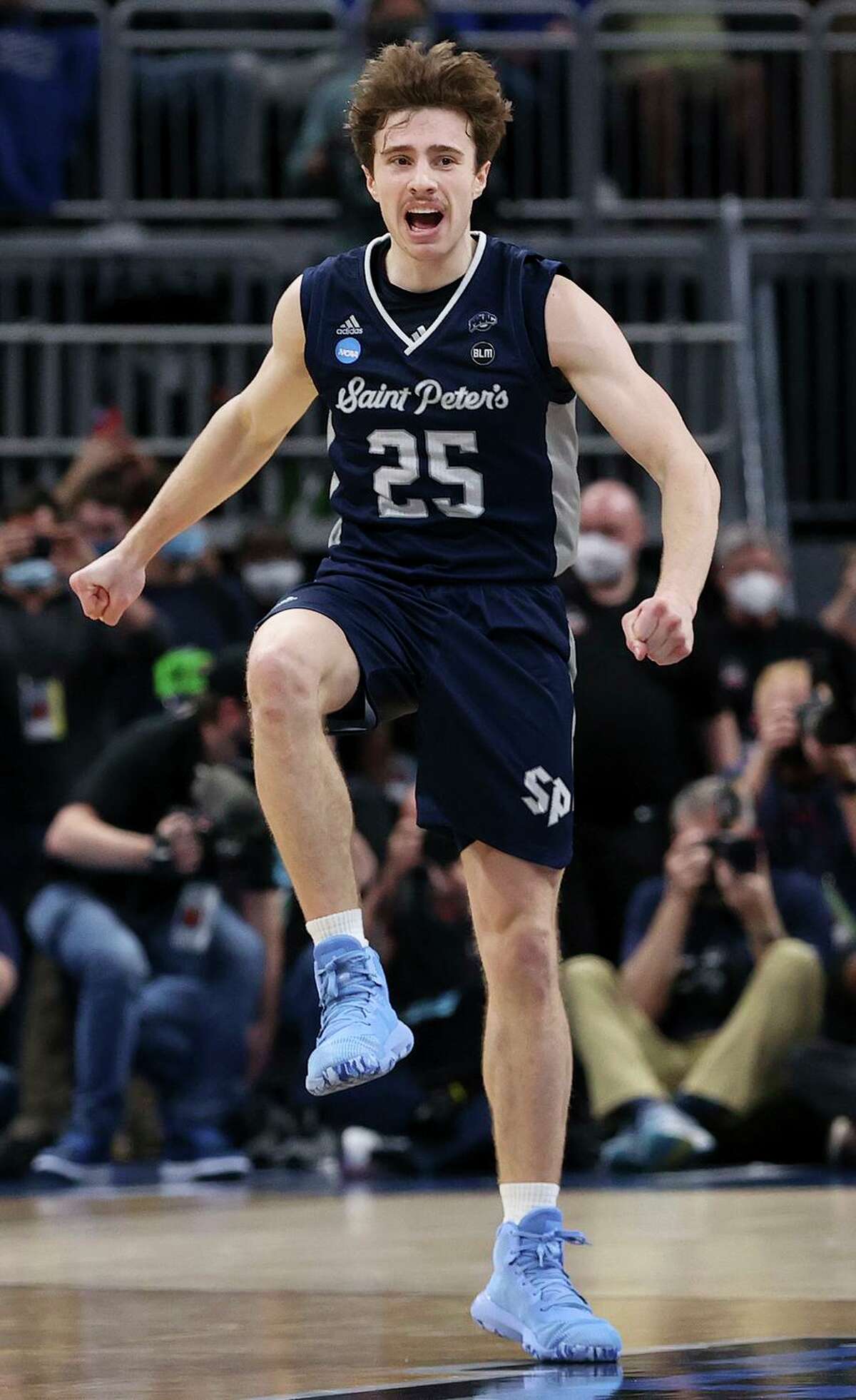 Saint Peter’s Doug Edert, whose layup sent the game to overtime, celebrates after drawing a foul late against Kentucky.