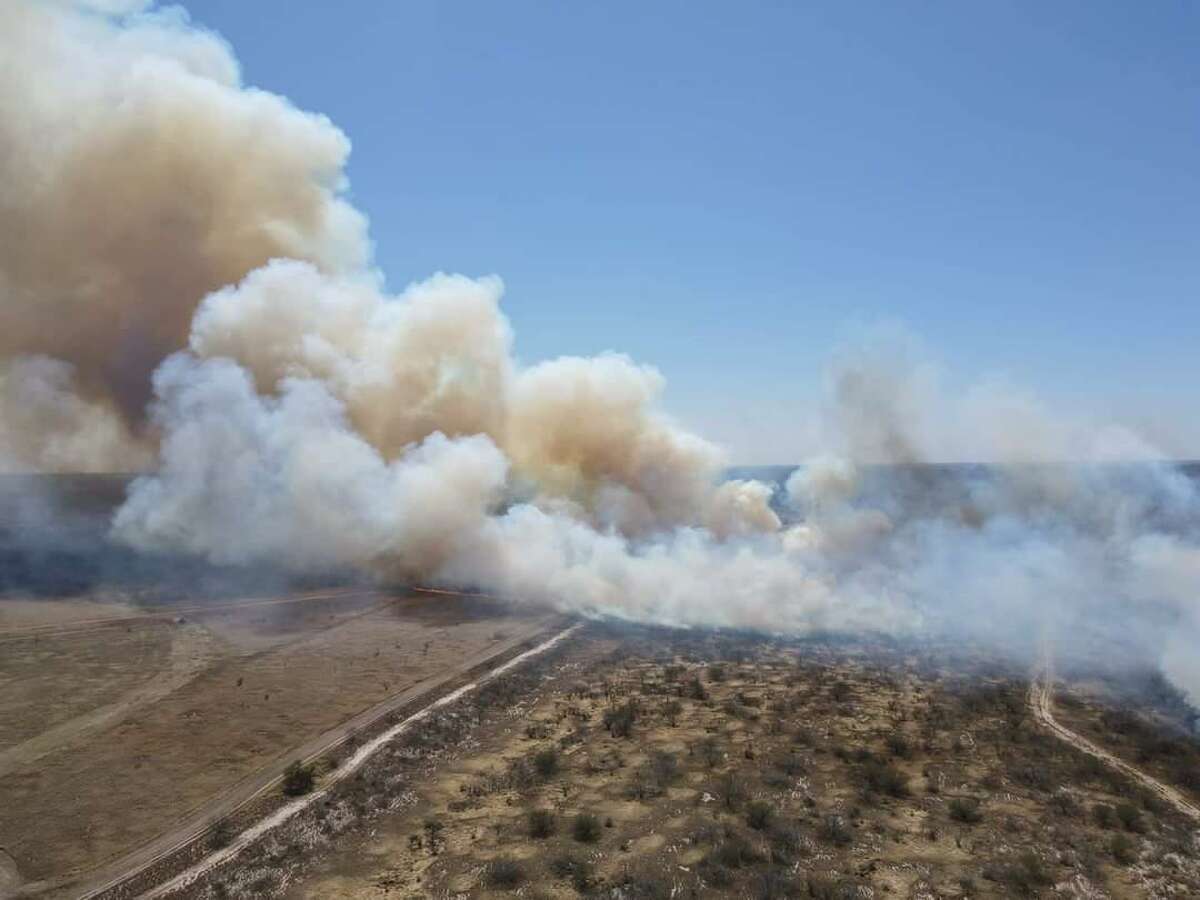 Pictures show brief moment that fire crossed from the Mexican side to the American side into an area near El Cenzo, Texas across the Rio Grande River on March 15, 2022. 