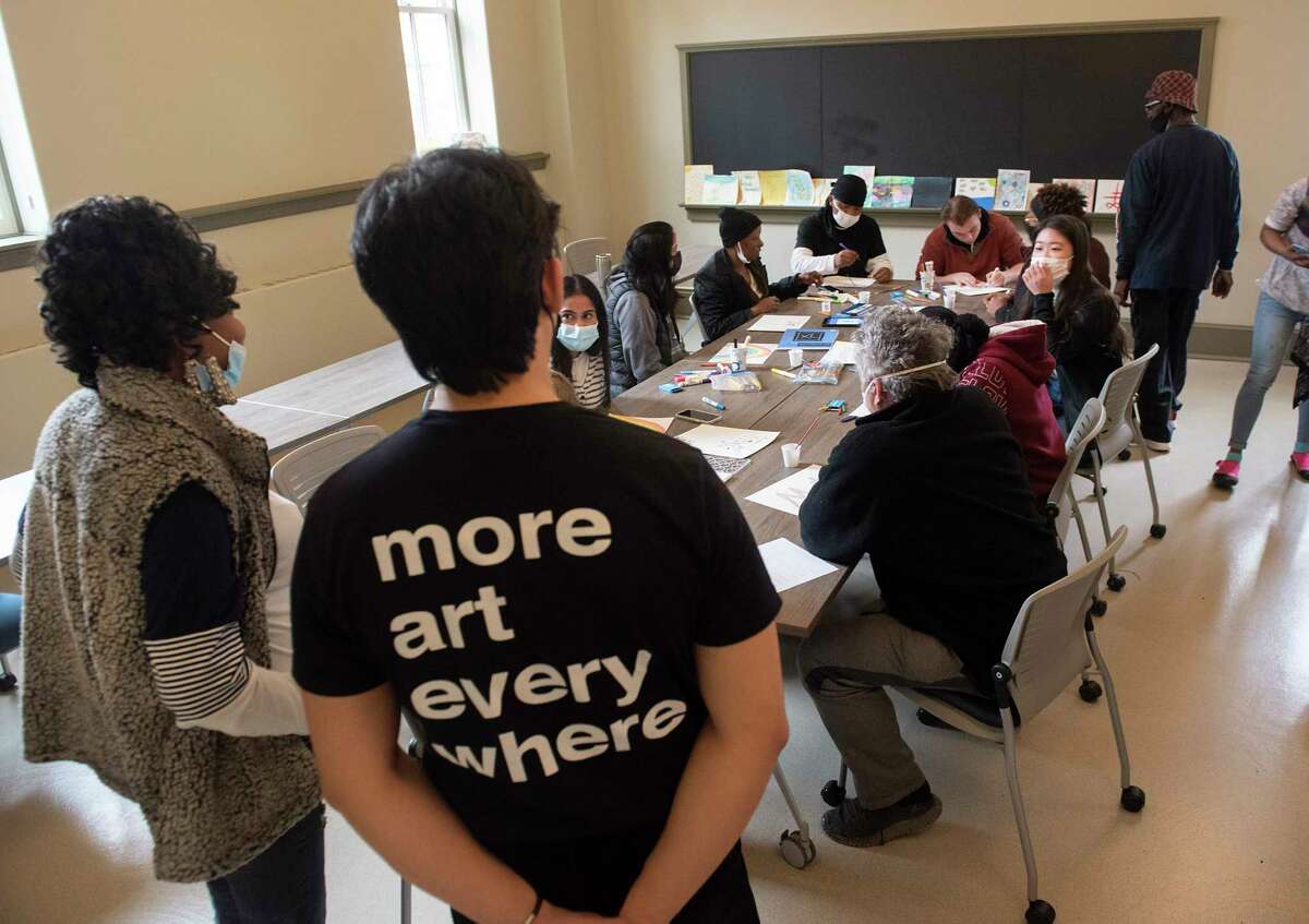Guest and interns make art during a watercolor painting class for the homeless at Community Connections on Friday, March 18, 2022 in Albany, N.Y.