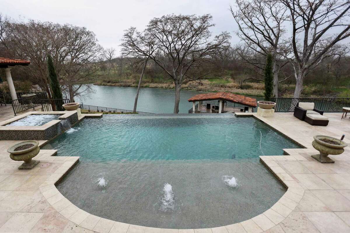 Lavish New Braunfels pool and spa on terraced backyard bring