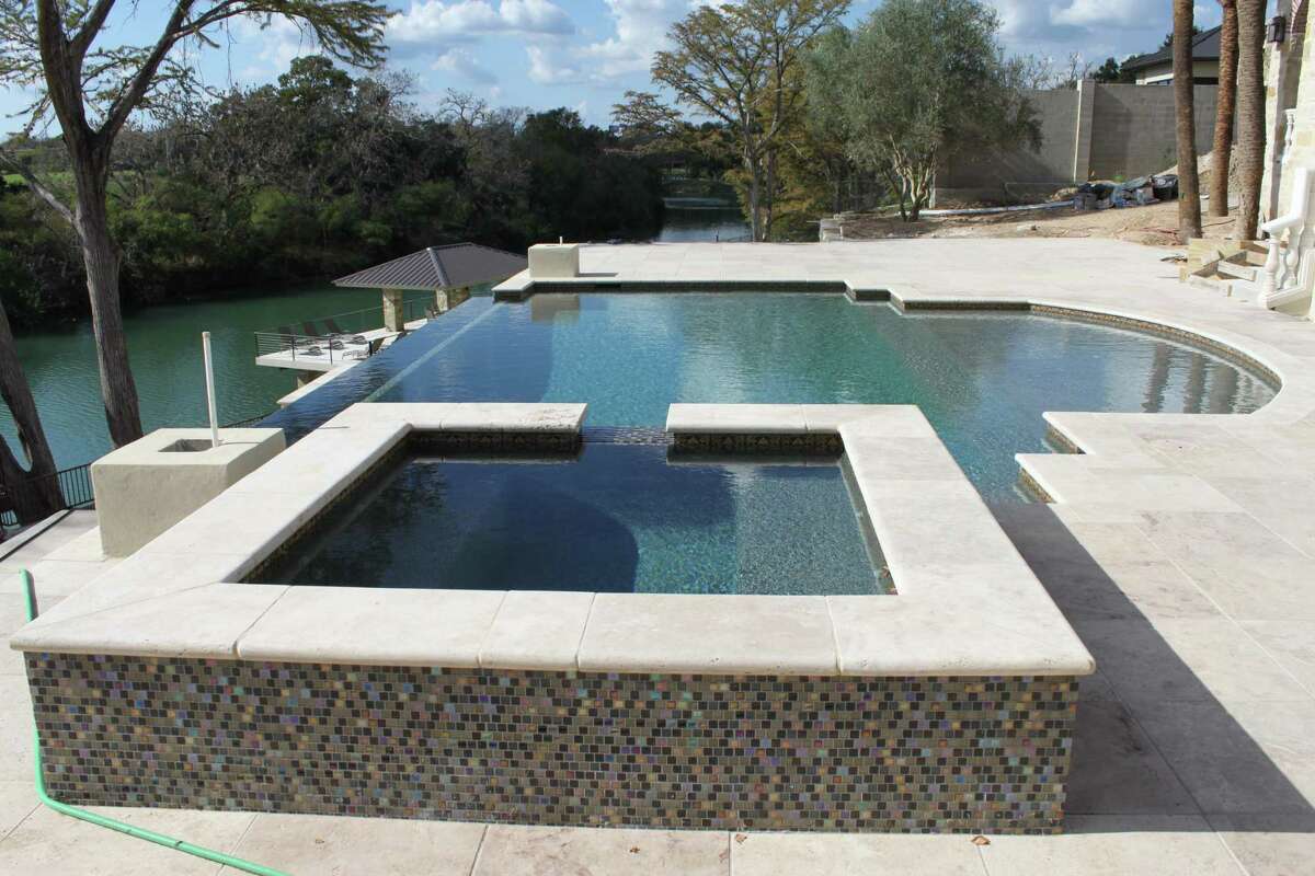 Lavish New Braunfels pool and spa on terraced backyard bring